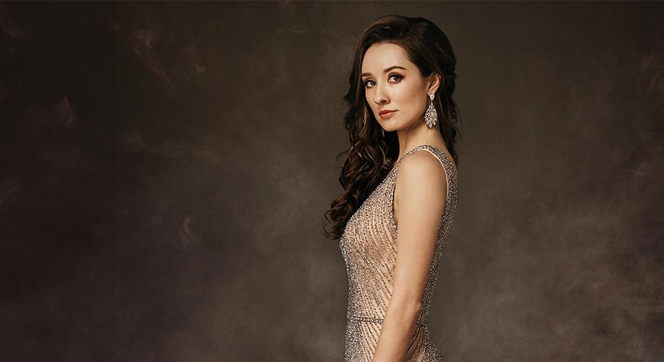 A woman in a formal gown.