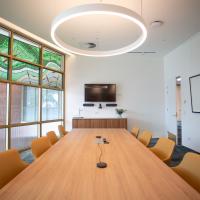 boardroom table and chairs with leadlight windows