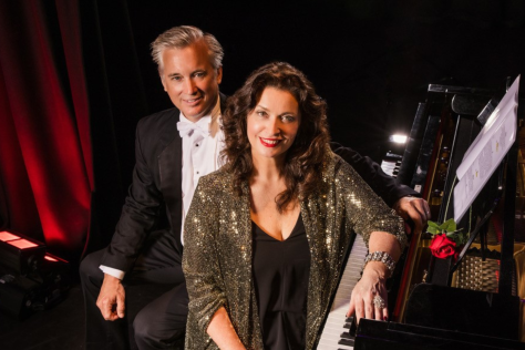 Ian and Michelle sitting next to piano