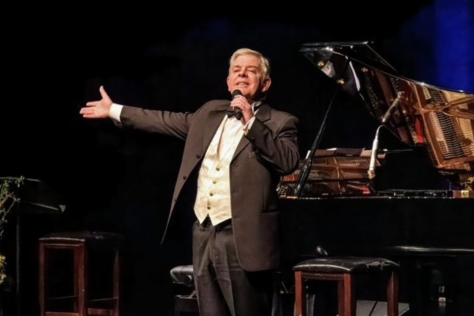 Tenor Roy Best singing on stage